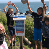 Kids joyous after using beach cleanup station to clean shoreline